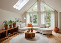 Bright modern living room with curved sofa and plants