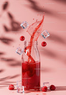 Splash of Raspberry Juice with Ice Cubes in Glass Bottle