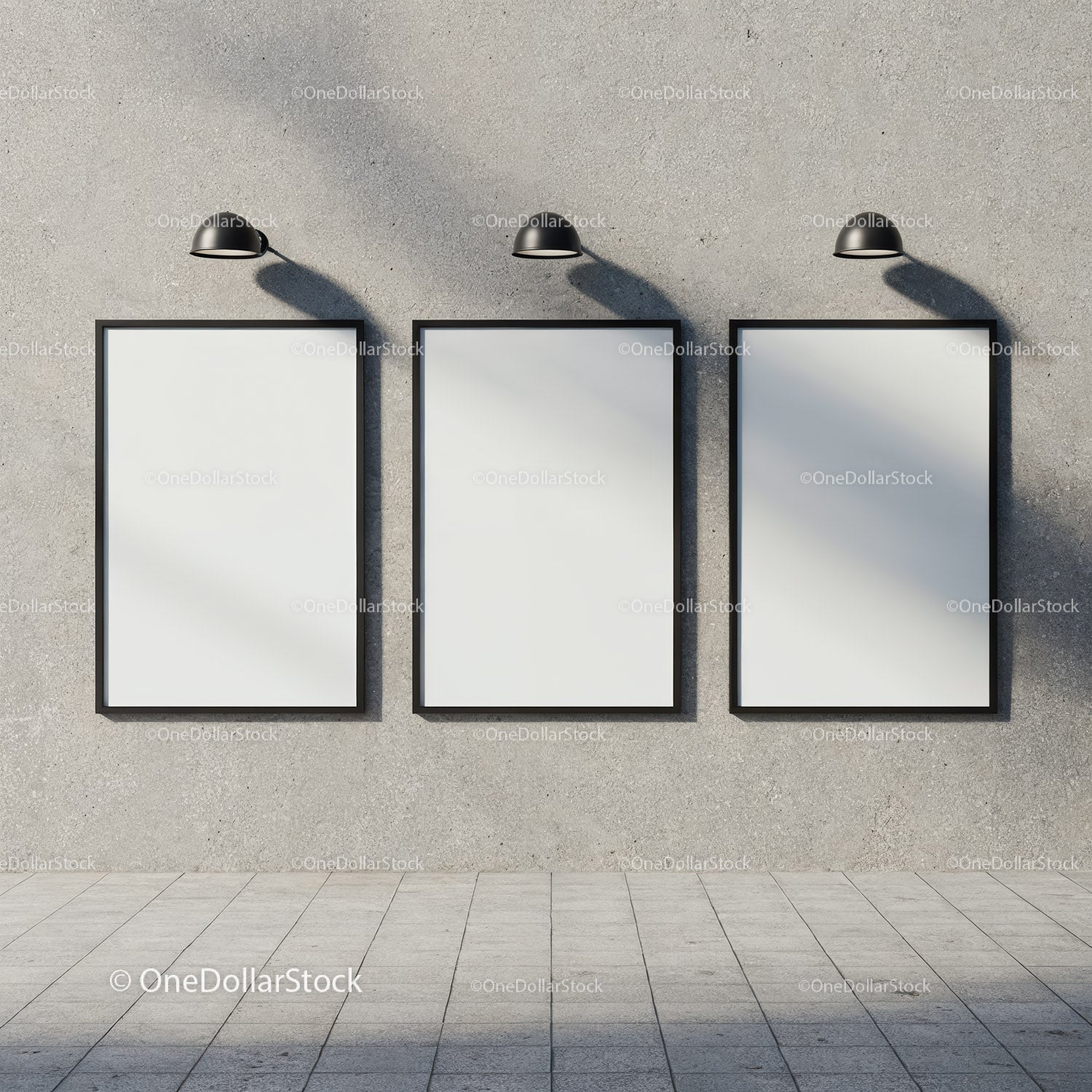 Three blank frames on urban concrete wall under lights