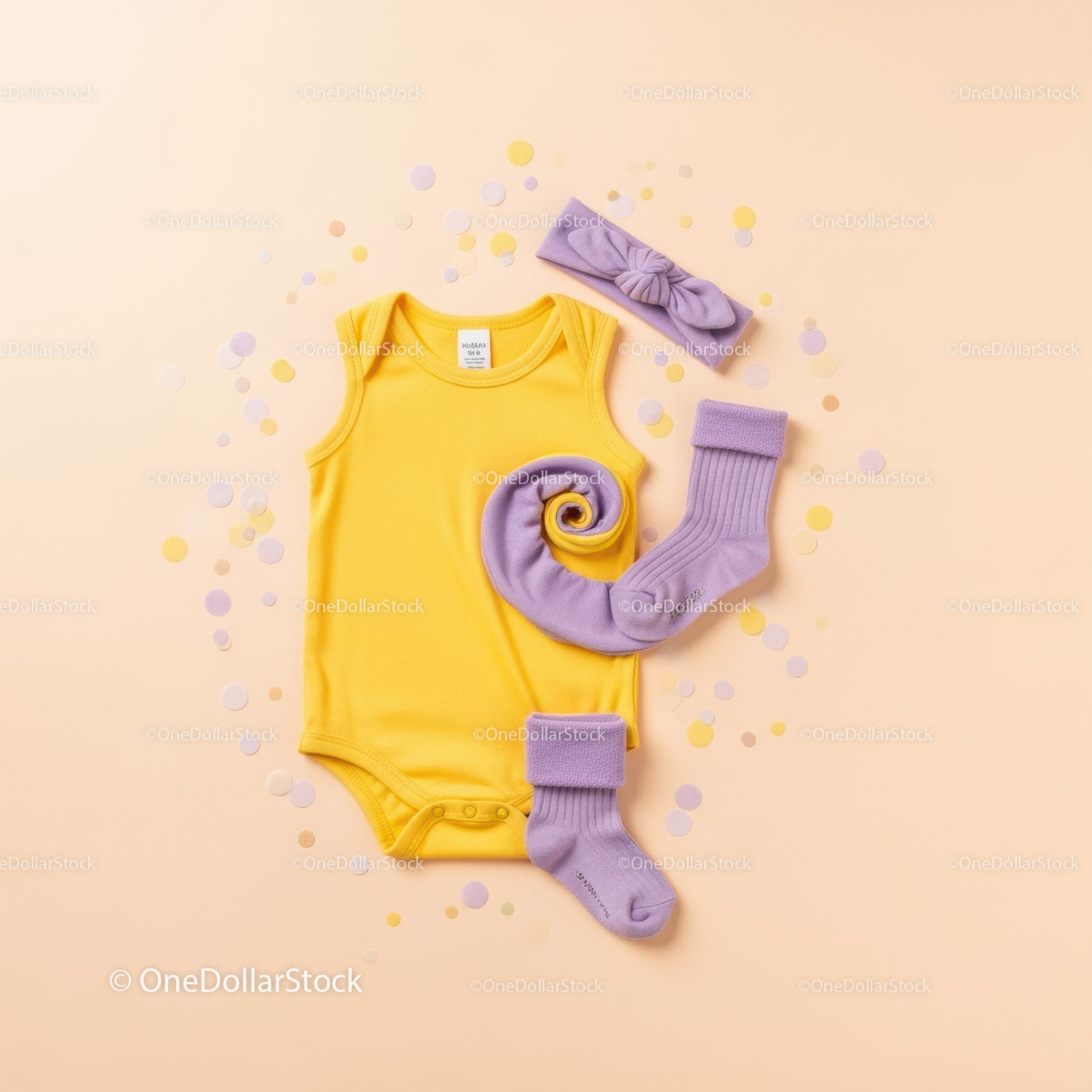 Yellow Baby Onesie with Purple Accessories Flat Lay