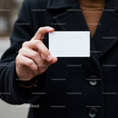 Person Holding Blank White Business Card Outdoors