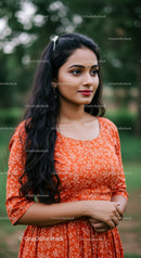 Elegant Young Woman in Traditional Floral Dress Outdoors