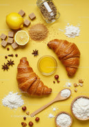 Freshly baked croissants with honey and natural ingredients
