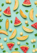 Fresh watermelon and cantaloupe slices with mint leaves