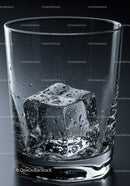 Close up of melting ice cube in clear glass