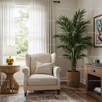 Elegant Living Room with Beige Armchair and Large Green Houseplant