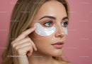 Close-Up of Woman with Blue Eyes Applying Under Eye Patches for Beauty