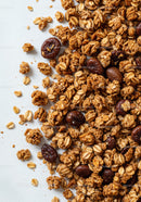 Crunchy granola mix with roasted coffee beans close up