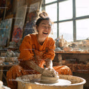 Joyful Woman Creating Handmade Pottery in Artistic Studio