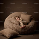 Sleeping toddler curled on soft knitted bean bag
