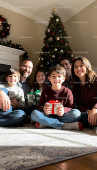 Happy Family Celebrating Christmas with Gifts at Home