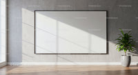 Minimalist room with blank frame and potted green plant