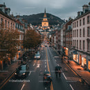 Charming European City Street with Historic Church and Twilight Atmosphere
