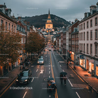 Charming European City Street with Historic Church and Twilight Atmosphere