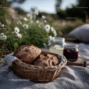 Rustic Bread Basket with Milk Jars and Daisy Flowers in Outdoor Setting