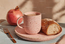 Rustic Breakfast Scene with Pomegranate Bread and Speckled Mug