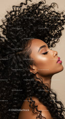 Profile of woman with voluminous curly hair and flawless skin
