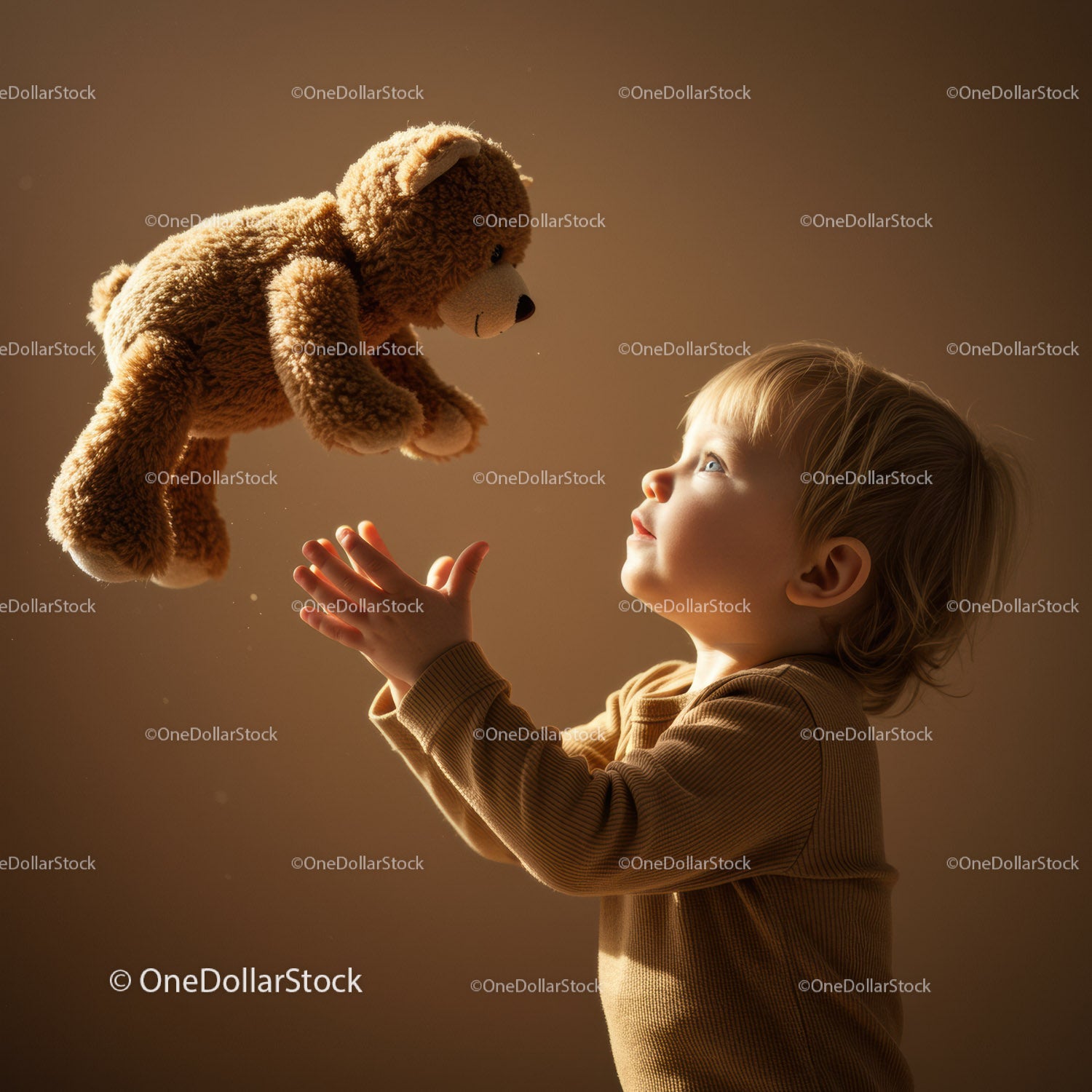 Toddler reaching out to a floating teddy bear