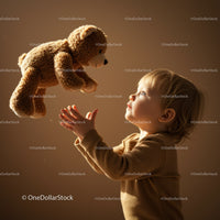 Toddler reaching out to a floating teddy bear