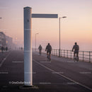 Early Morning Cyclists on Coastal Promenade