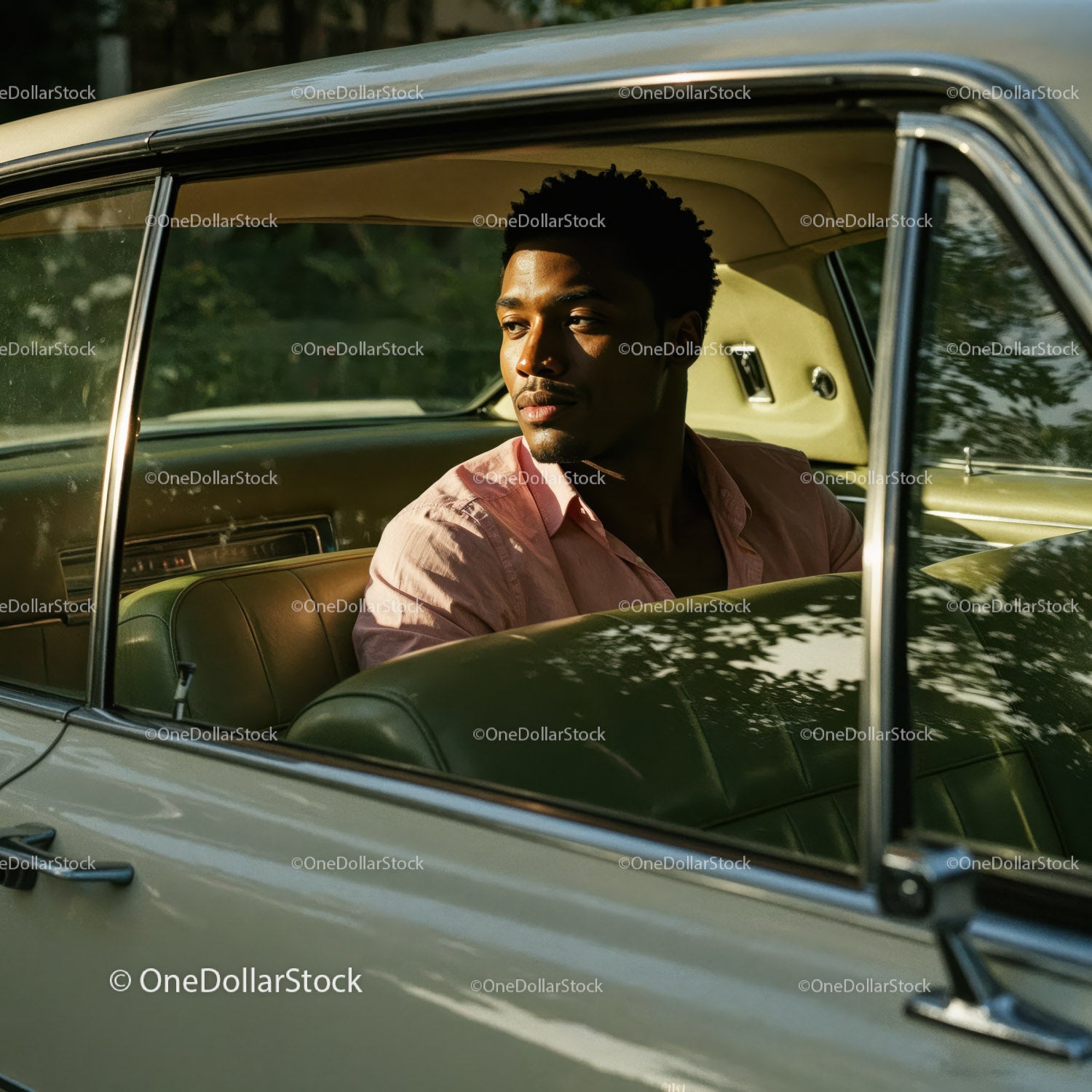 Young Man Sitting in Vintage Car Looking Out Window