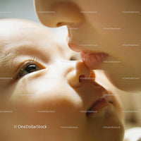 Tender moment of gentle kiss between mother and baby