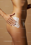 Enhancing Skin with Moisturizing Lotion on Tanned Female Body