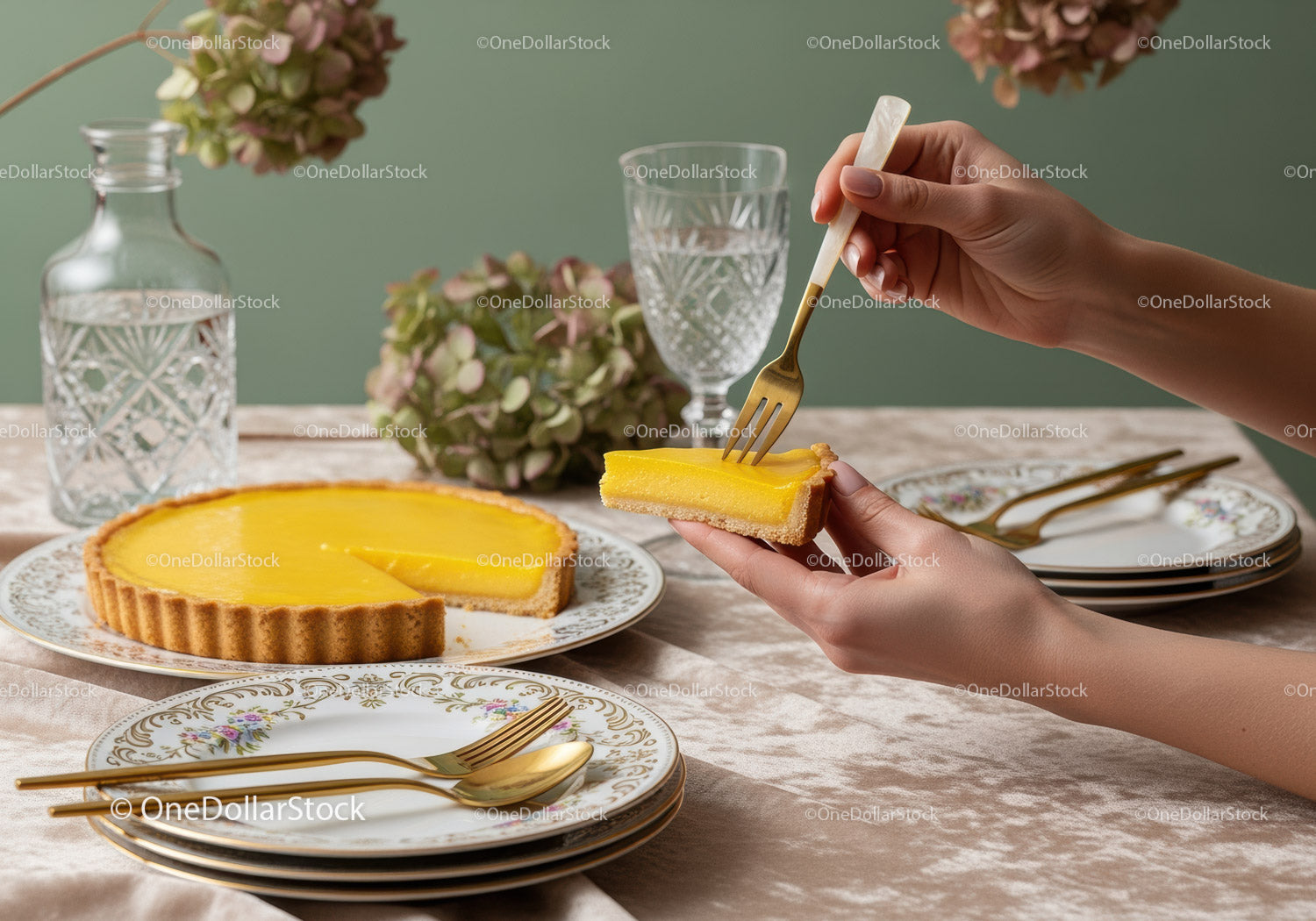 Elegant Lemon Tart on Vintage Floral Plates with Gold Cutlery and Fresh Flowers