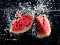 Juicy Watermelon Slices Splashing into Water in Refreshing Summer Scene