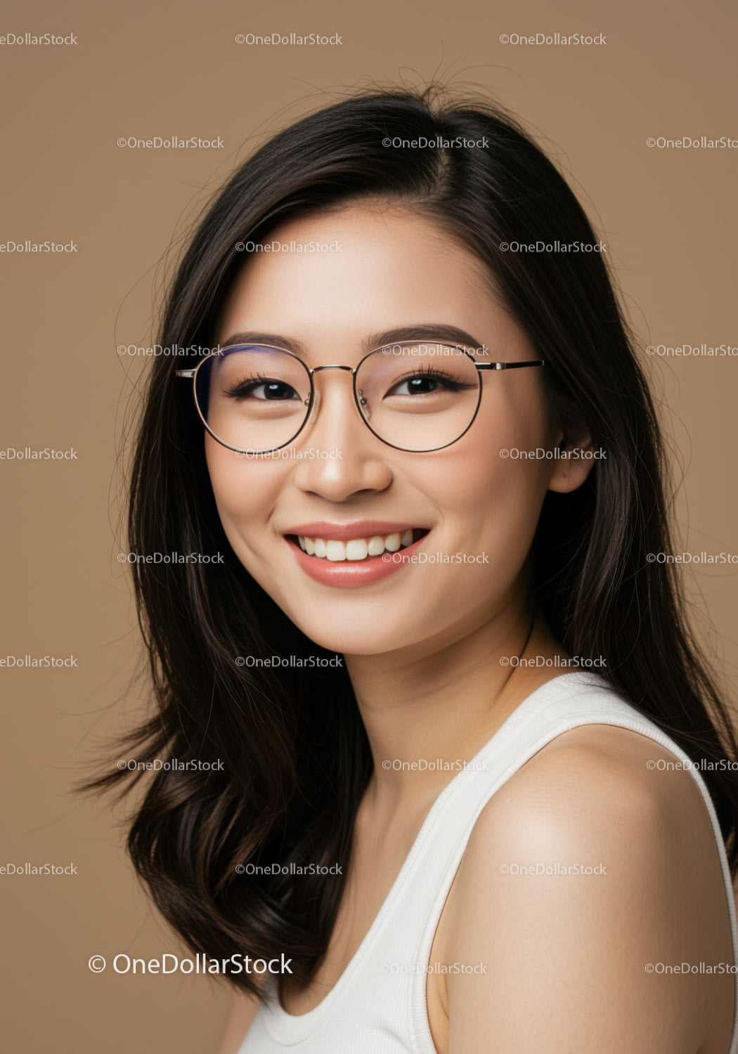 Portrait of a Happy Asian Woman in Glasses with Bright Smile