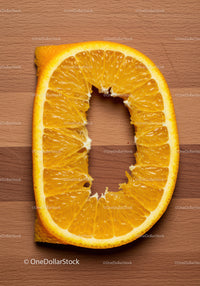 Fresh orange slice on wooden cutting board