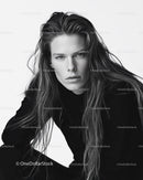 Black and White Portrait of a Woman with Long Hair and Intense Gaze