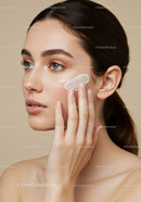 Close-up of Young Woman Applying Face Cream for Skincare Routine
