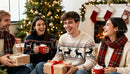 Friends enjoying Christmas gifts and hot drinks indoors