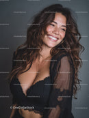 Joyful Woman with Long Wavy Hair Wearing Black Lace Lingerie