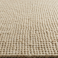 Close-up of Beige Woven Rug with Textured Pattern for Modern Interior Decor