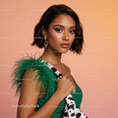 Elegant Woman in Green Outfit with Feathered Shoulder and Animal Print Dress