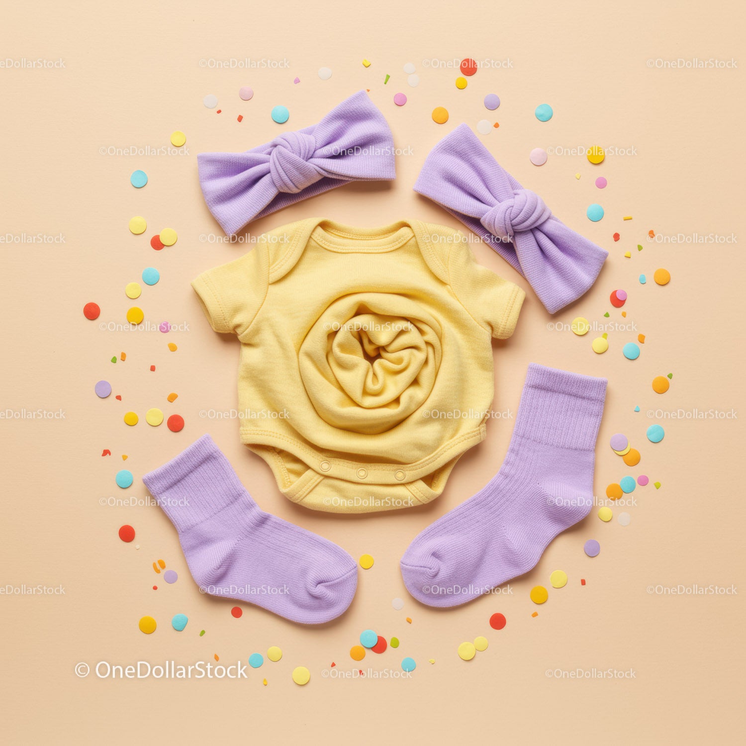 Bright baby clothes set with purple accessories flat lay