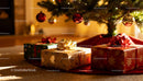Christmas gifts under decorated tree with glowing lights