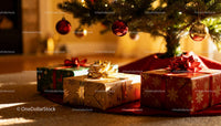 Christmas gifts under decorated tree with glowing lights