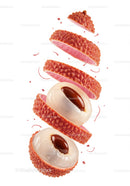 Sliced lychee fruit with glossy seed on white background