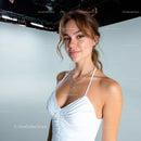 Young Woman Smiling in Casual White Top in Studio