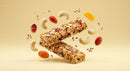 Healthy granola bars with nuts and dried fruits floating