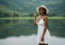 Elegant Woman in White Sundress Enjoying Lakeside Nature Scene