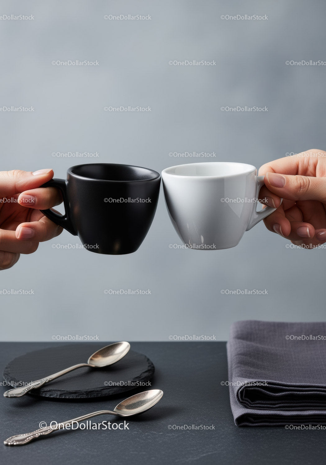 Stylish Black and White Ceramic Coffee Mugs Clinking in Modern Kitchen