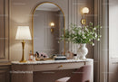 Elegant makeup vanity with floral decor and golden accents