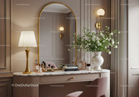 Elegant makeup vanity with floral decor and golden accents