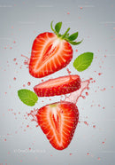 Fresh juicy strawberry slices splashing with mint leaves