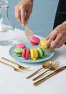 Colorful Macarons on Elegant Dessert Plate with Gold Cutlery