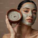 Woman with clay facial mask and bowl of facial cream in beauty spa
